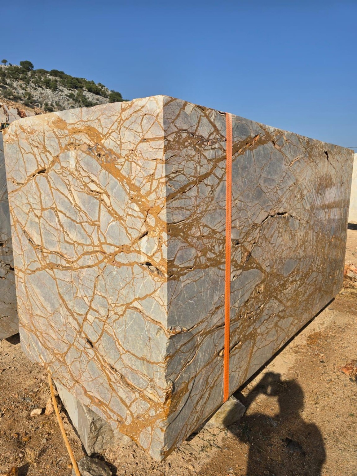 Stone block with golden veins