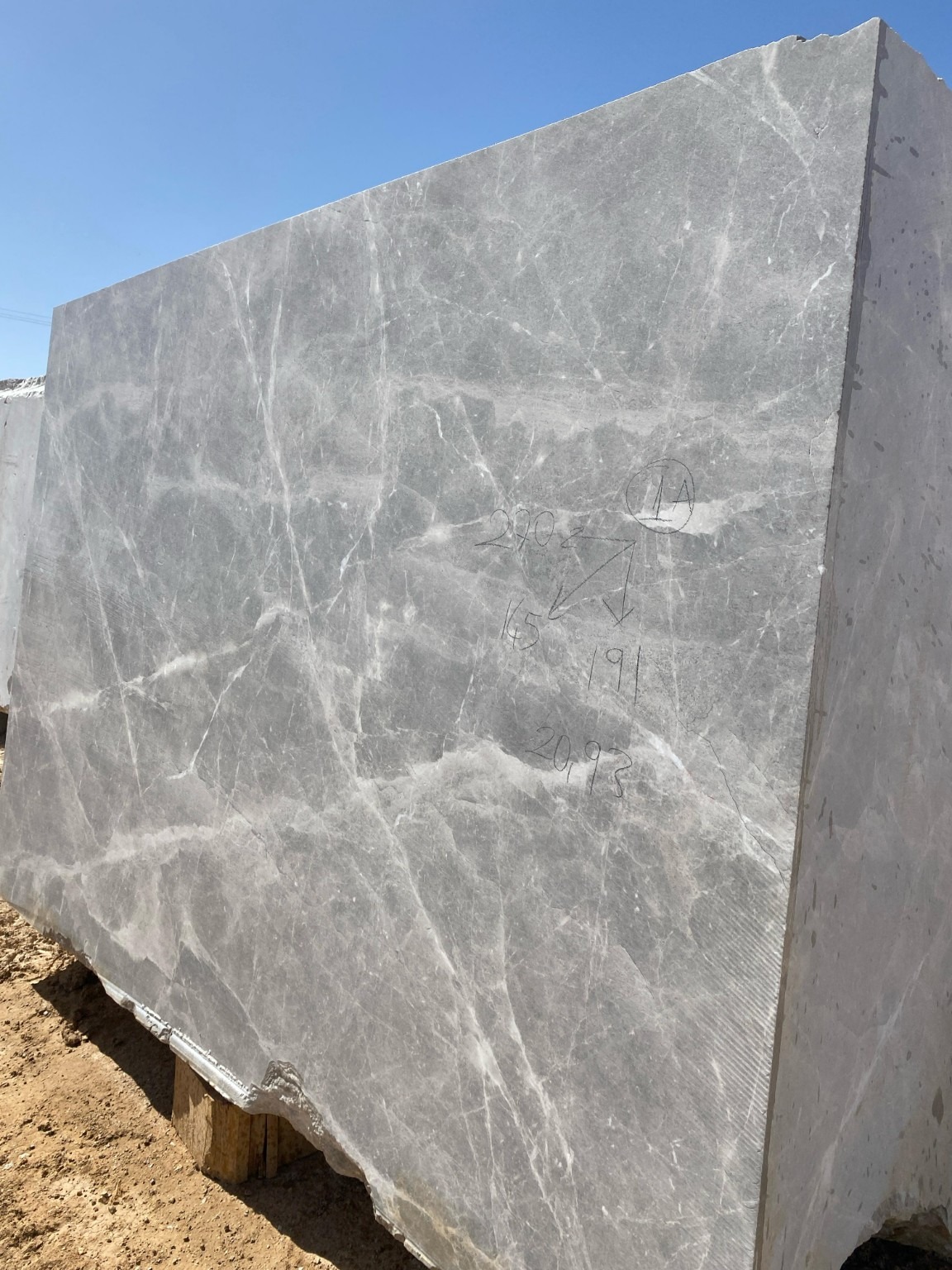 Grey stone block with pale veins